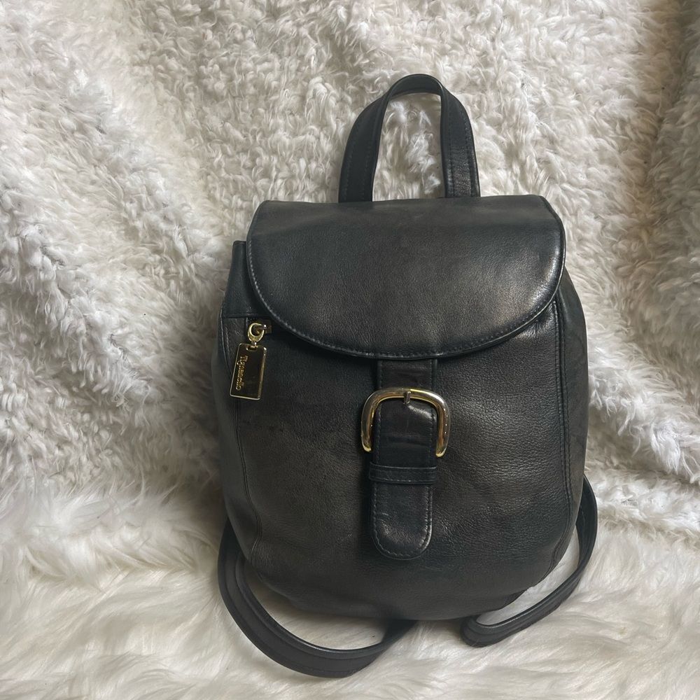Tignanello leather black small backpack/ sling back with gold tone hardwares..